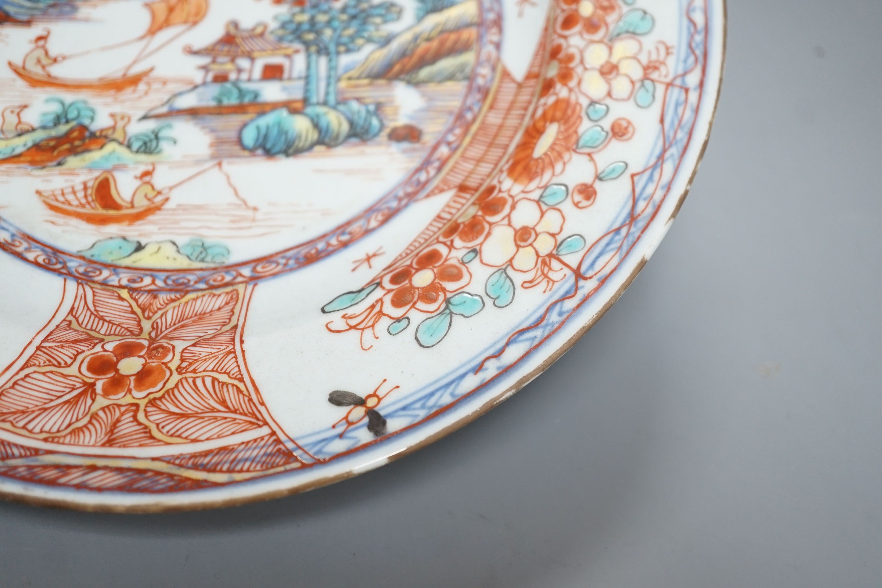 An 18th century Chinese clobbered plate, 23 cms diameter.